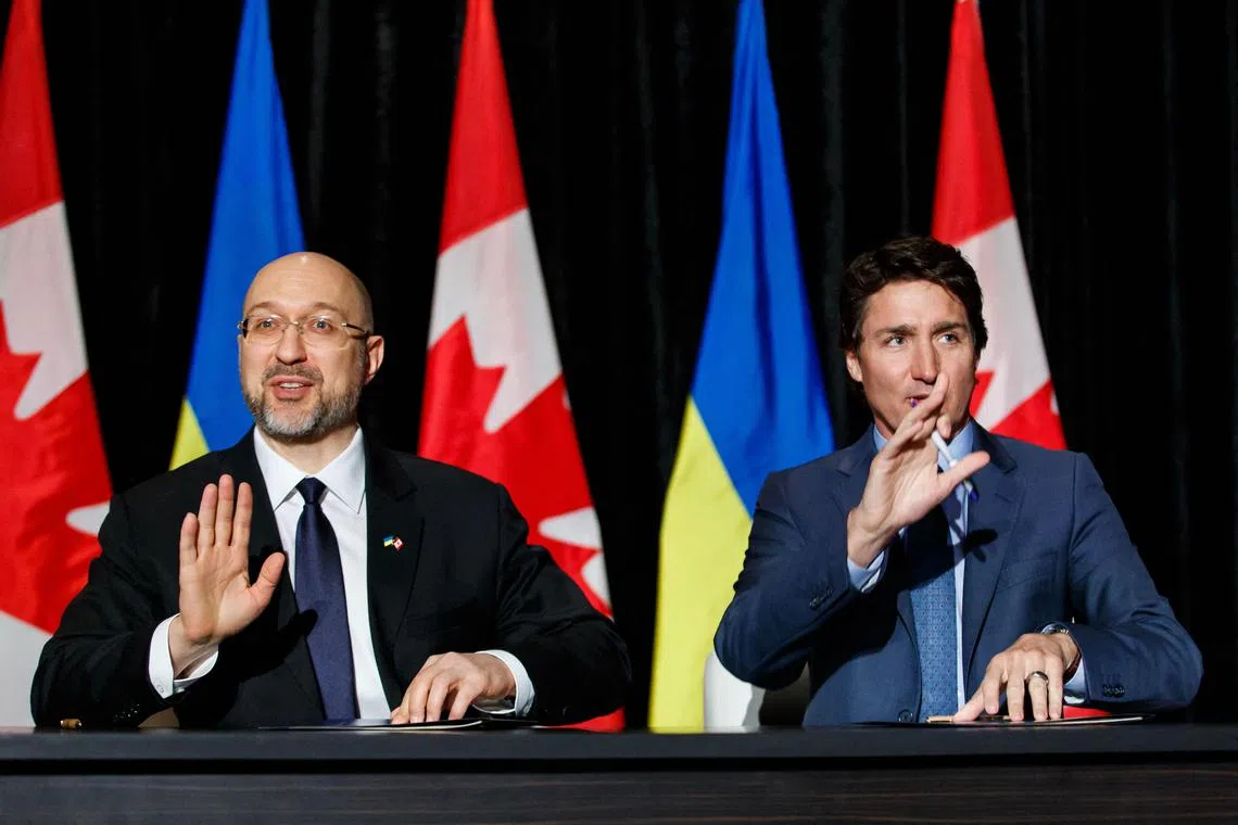 Ukrainian Prime Minister Denys Shmyhal (left) is pictured with Canadian Prime Minister Justin Trudeau during a visit to Canada this month.
