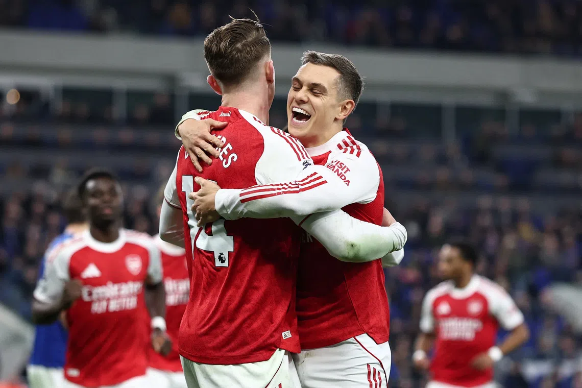 Soccer Football - Premier League - Everton v Arsenal - Hill Dickinson Stadium, Liverpool, Britain - December 20, 2025 Arsenal's Viktor Gyokeres celebrates scoring their first goal with Leandro Trossard REUTERS/David Klein