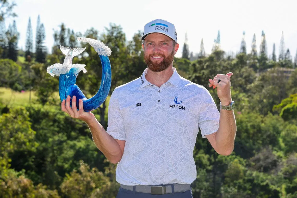 Chris Kirk of the United States celebrating with the trophy after winning the final round of The Sentry at Plantation Course at Kapalua Golf Club.