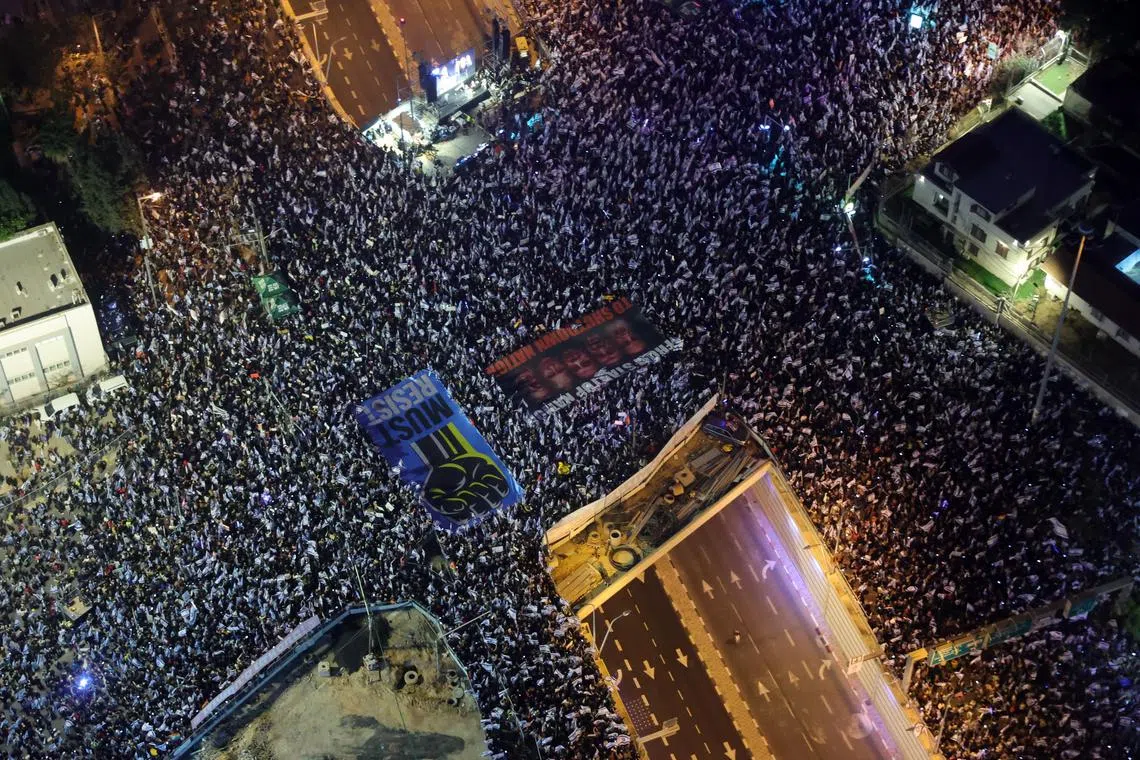 People protest against the government justice system reform plan in Tel Aviv, Israel, 04 March 2023. Nationwide protests have been held for weeks against the government’s proposed justice system reform, which critics say would weaken the power of the Israeli Supreme Court and the rule of law.  EPA-EFE/ABIR SULTAN