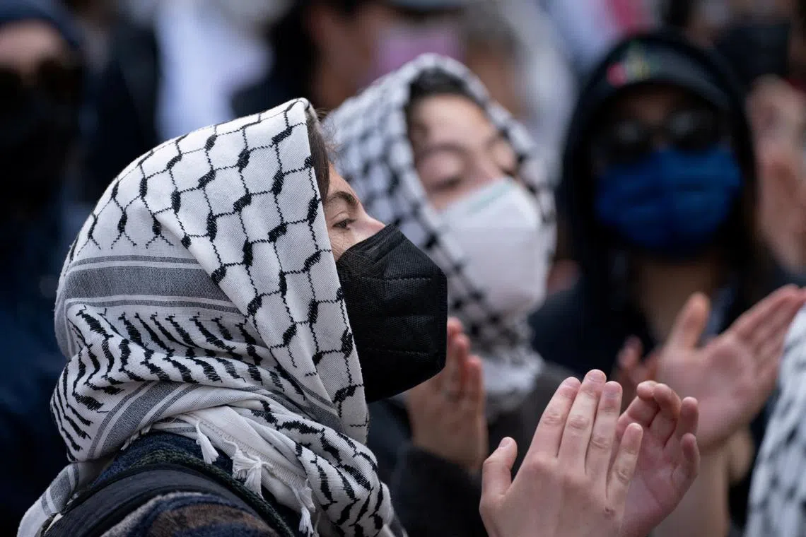 FILE PHOTO: Protestors gather at the gates of Columbia University, in support of student protesters who barricaded themselves in Hamilton Hall, despite orders from university officials to disband or face suspension, during the ongoing conflict between Israel and the Palestinian Islamist group Hamas, in New York City, U.S., April 30, 2024. REUTERS/David Dee Delgado/File Photo