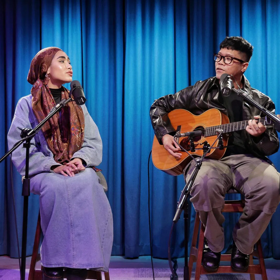 Rising Singaporean singer-songwriter Shazza (left) performing live with fellow musician Umar Sirhan during ST’s Music Lab podcast at SPH Media's Studio+65.