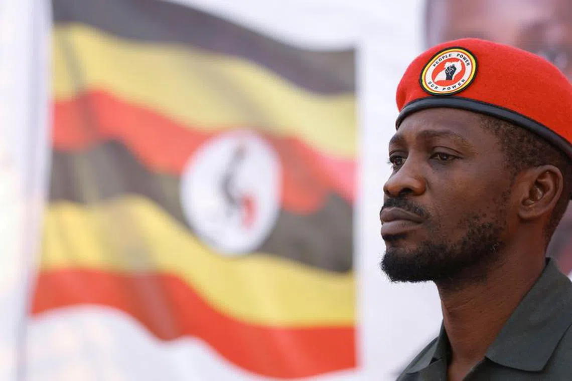 FILE PHOTO: Ugandan opposition leader and singer Robert Kyagulanyi Ssentamu, known as Bobi Wine looks on after his arrival to address Ugandans living in South Africa on political issues in their home country, at the sports ground in Germiston, southeast of Johannesburg, South Africa, October 3, 2023. REUTERS/Siphiwe Sibeko/File Photo