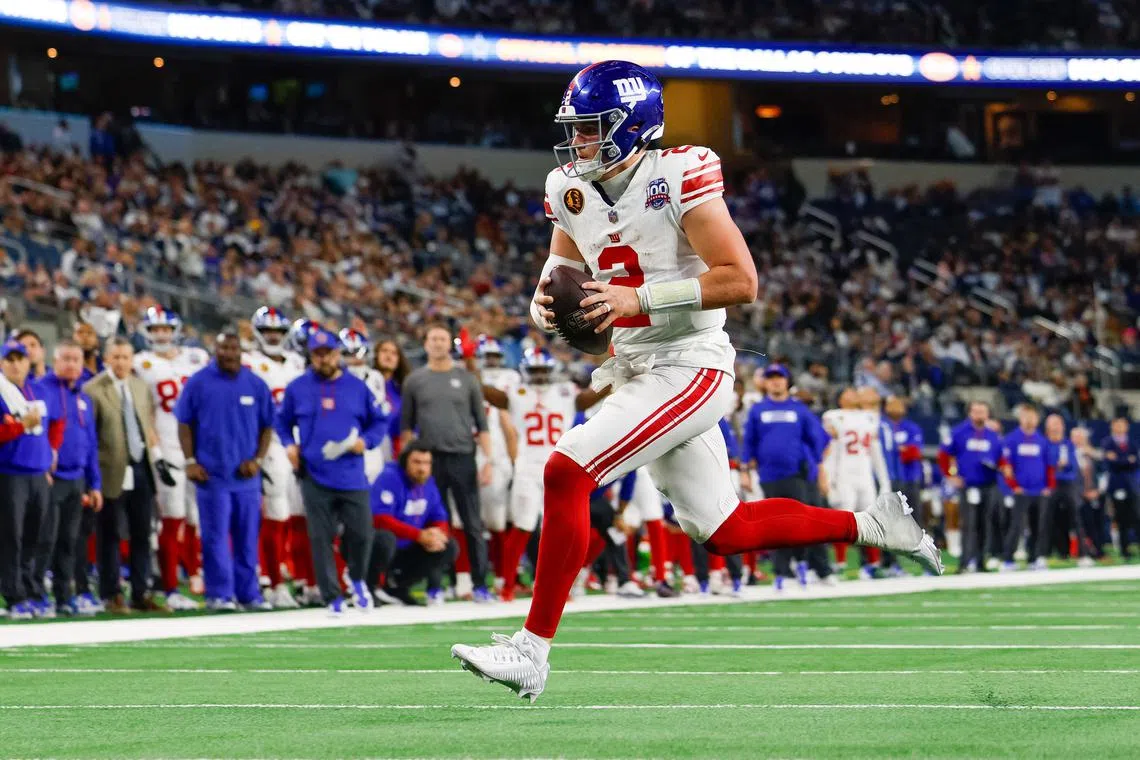 Nov 28, 2024; Arlington, Texas, USA; New York Giants quarterback Drew Lock (2) rushes for a touchdown during the fourth quarter against the Dallas Cowboys at AT&T Stadium. Andrew Dieb-Imagn Images/File Photo