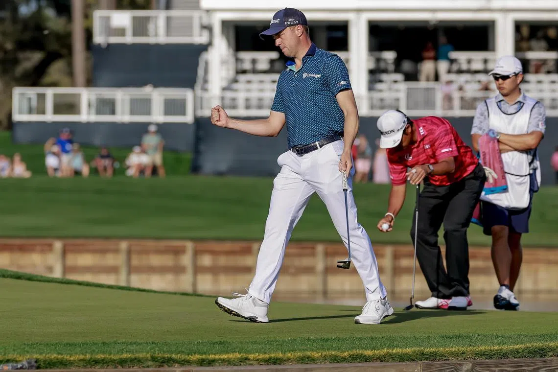 Justin Thomas reacts after making a birdie putt on the 17th hole during the second round of The Players Championship.
