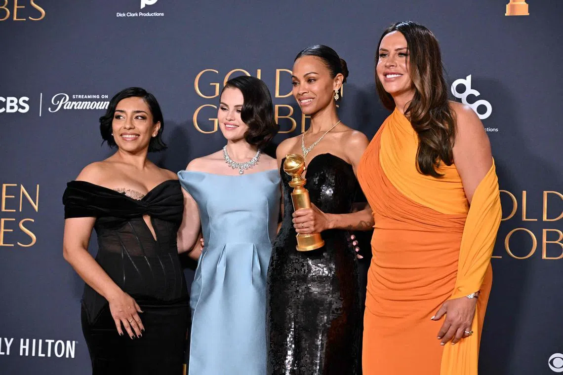 (From left) Actresses Adriana Paz, Selena Gomez, Zoe Saldana and Karla Sofia Gascon pose with the Best Motion Picture - Musical or Comedy award for "Emilia Perez" on Jan 5.