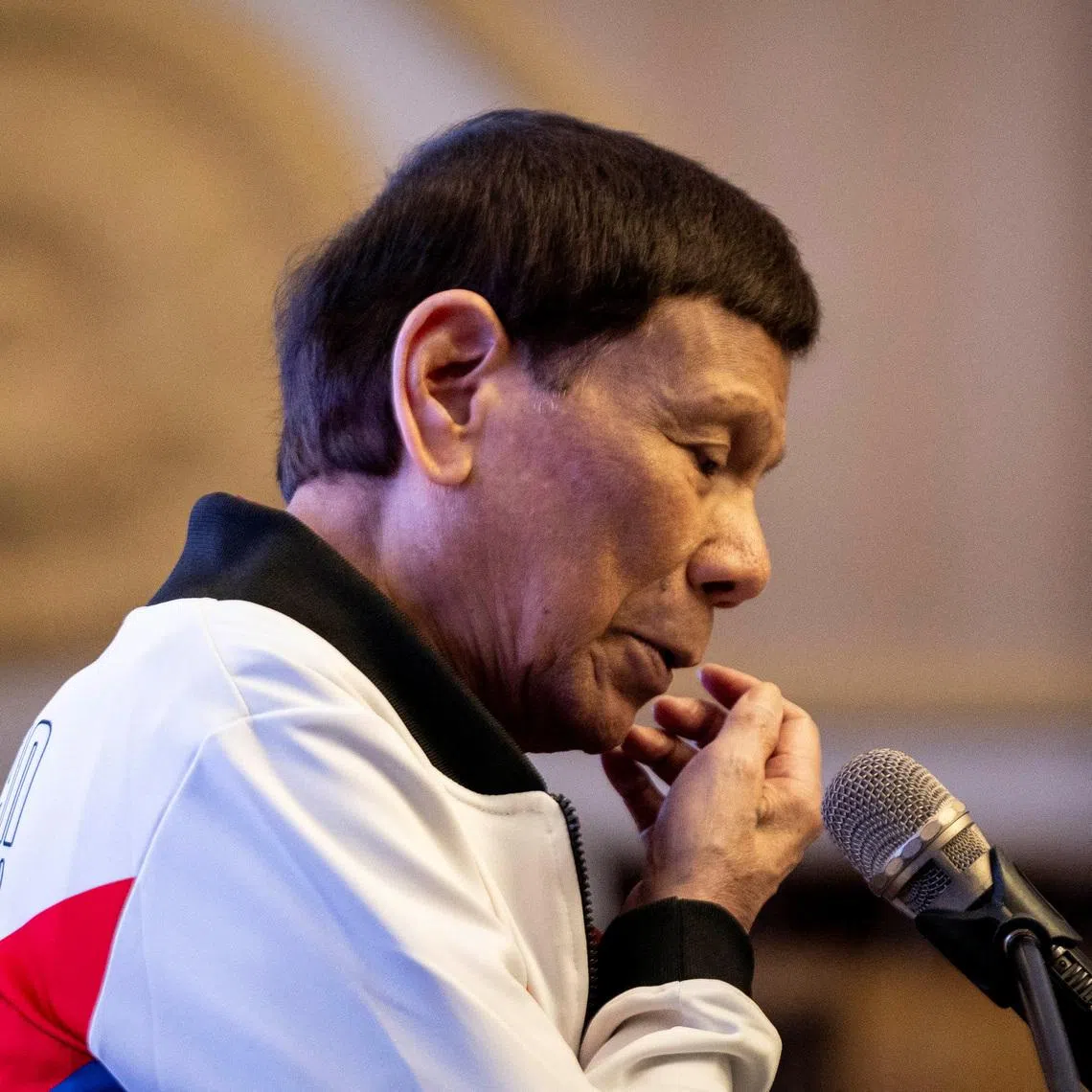 Former Philippine president Rodrigo Duterte gestures as he delivers a message during the proclamation rally for his political party PDP-Laban's senatorial candidates ahead of the midterm elections, at Club Filipino in San Juan, Metro Manila, Philippines, February 13, 2025. REUTERS/Eloisa Lopez