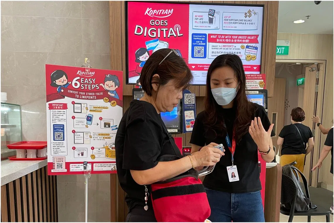 Digital buddies engaging customers at Causeway Point Kopitiam. Top-ups for the cards ended on March 1.