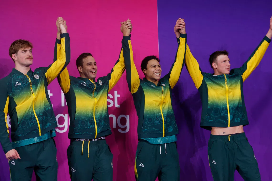 Bronze medallists South Africa’s Pieter Coetze, Michael Houlie, Chad le Clos and Ruard van Renen celebrate on the podium after the men’s 4 x 100m medley relay final.