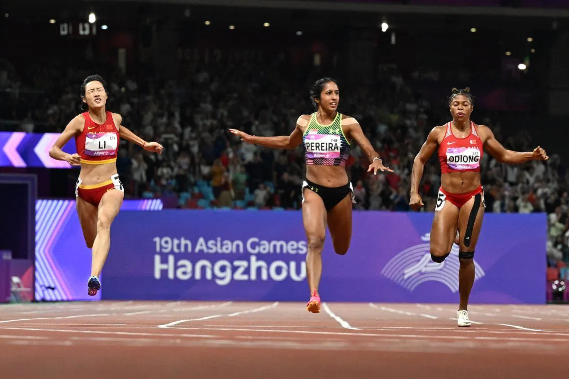 Singapore sprinter Shanti Pereira winning the women’s 200m title at the Asian Games 2023 in Hangzhou ahead of China’s Li Yuting (23.28sec) and Bahraini Edidiong Ofonime Odiong (23.48sec), 2 October 2023.