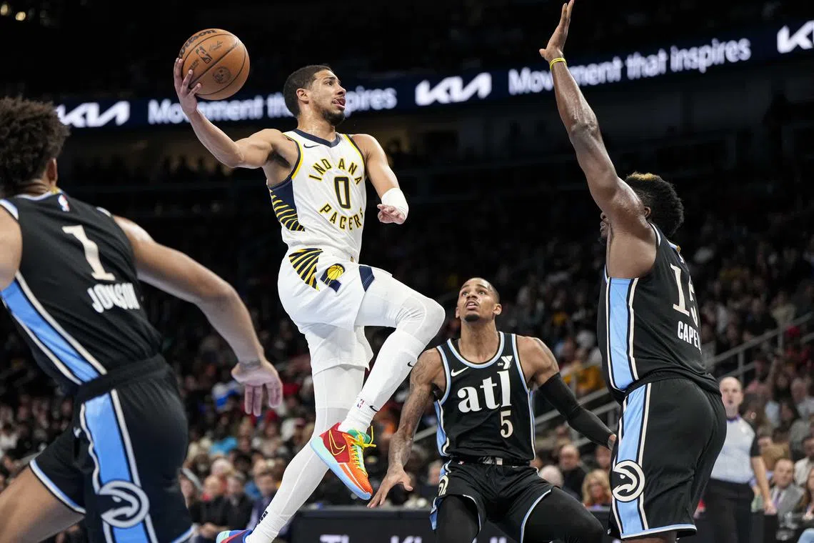 Indiana Pacers guard Tyrese Haliburton driving to the basket against the Atlanta Hawks during the second half at State Farm Arena. 