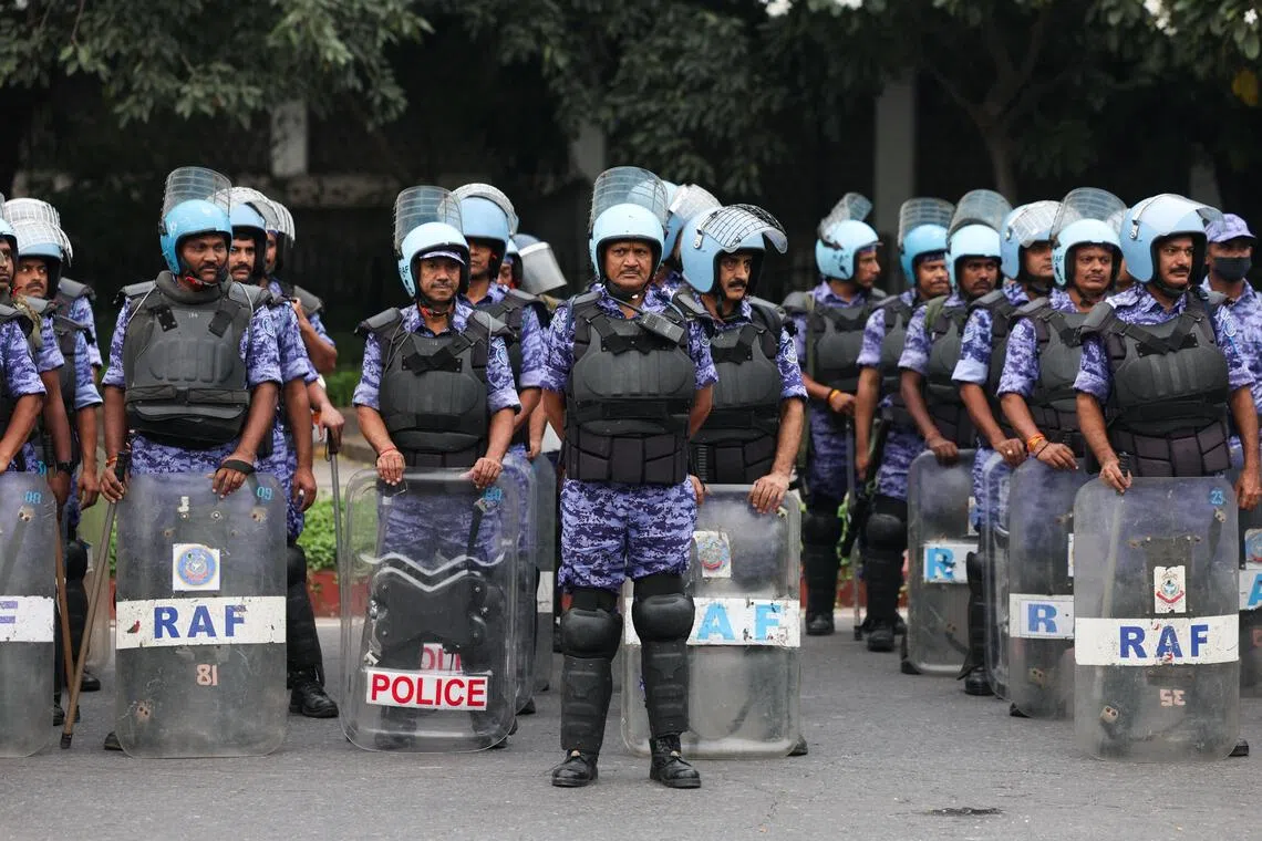 Members of the Rapid Action Force stand guard in New Delhi on Oct 10.