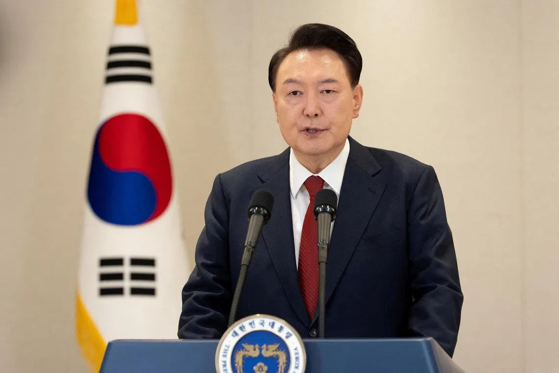 South Korea's President Yoon Suk Yeol delivers an address to the nation at the Presidential Office in Seoul, on Dec 12.