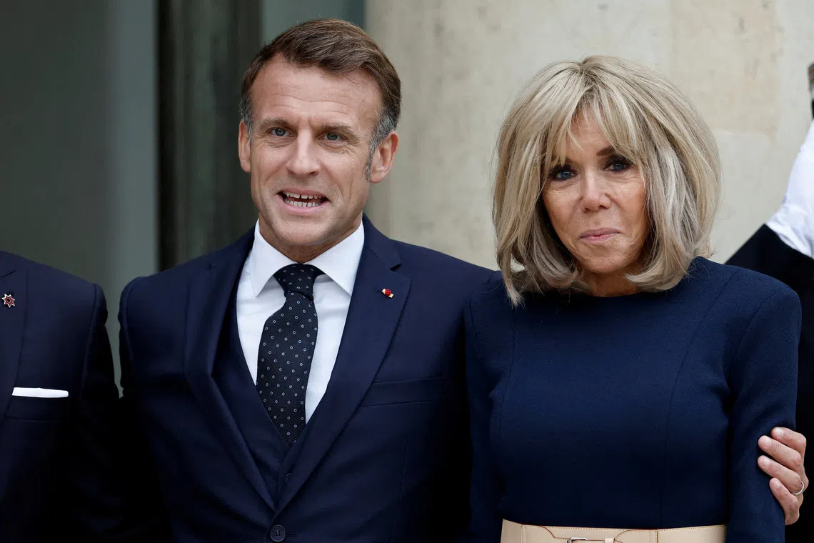 FILE PHOTO: French President Emmanuel Macron and his wife Brigitte Macron welcome Hussein bin Abdullah, Crown Prince of Jordan, and his wife Rajwa Al Hussein (not seen) for a working lunch at the Elysee Palace in Paris, France, October 8, 2025. REUTERS/Benoit Tessier/File Photo