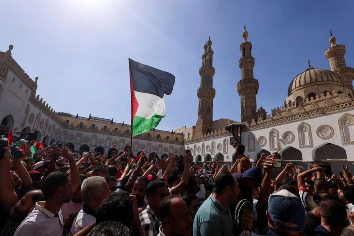 People take part in a protest in support of Palestinians, amid the ongoing conflict between Israel and Palestinian Islamist group Hamas, at al-Azhar Mosque in Old Cairo, Egypt, October 20, 2023. REUTERS/Mohamed Abd El Ghany/File Photo