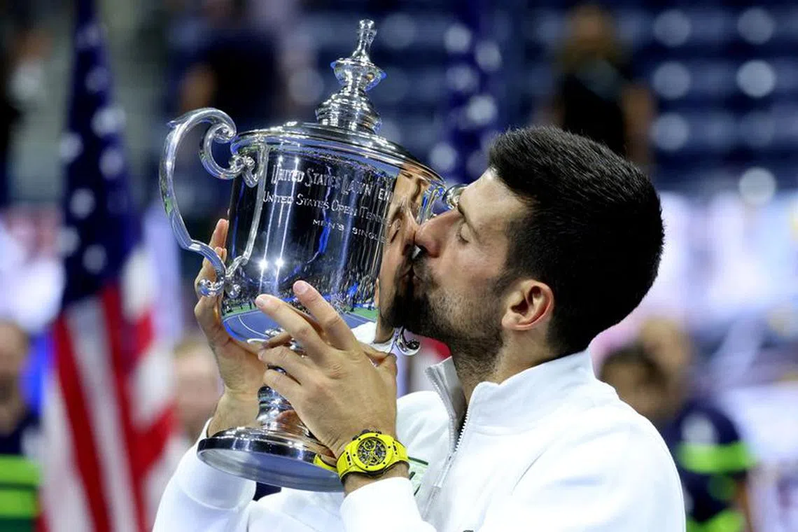 Tennis - U.S. Open - Flushing Meadows, New York, United States - September 10, 2023 Serbia's Novak Djokovic celebrates with the trophy after winning the U.S. Open REUTERS/Mike Segar/File photo