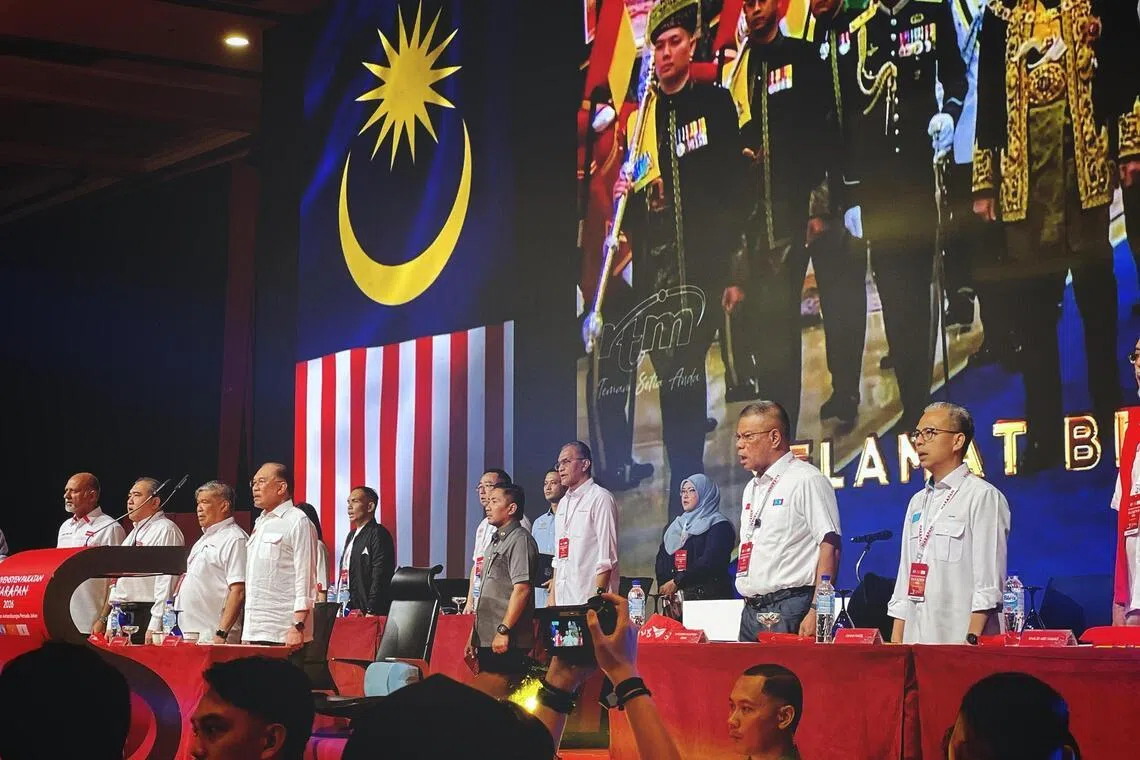 Pakatan Harapan’s central leadership led by Prime Minister Anwar Ibrahim (fourth from left) singing Negaraku during the PH Convention held at the Persada Johor International Convention  centre in Johor Bahru on May 17.