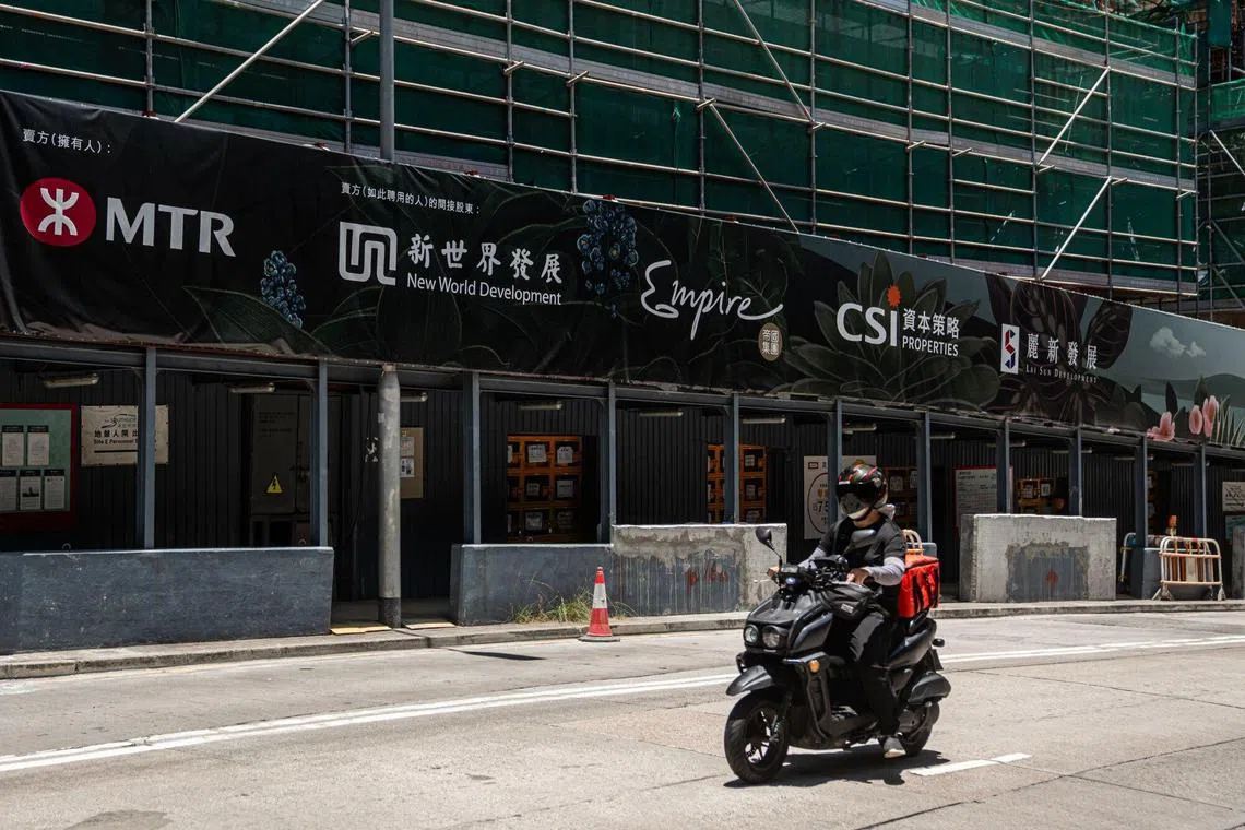 Signage of New World Development at the construction site of the companys Deep Water Pavilia project in Hong Kong on June. 7, 2025. 