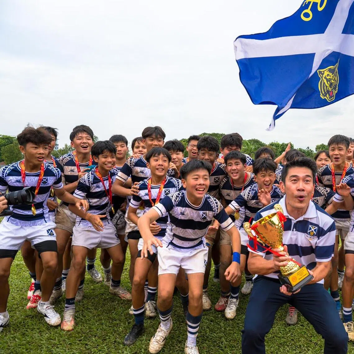 Principal Lee Han Hwa with his students who won the National School Games C Division rugby boys final on Aug 20.