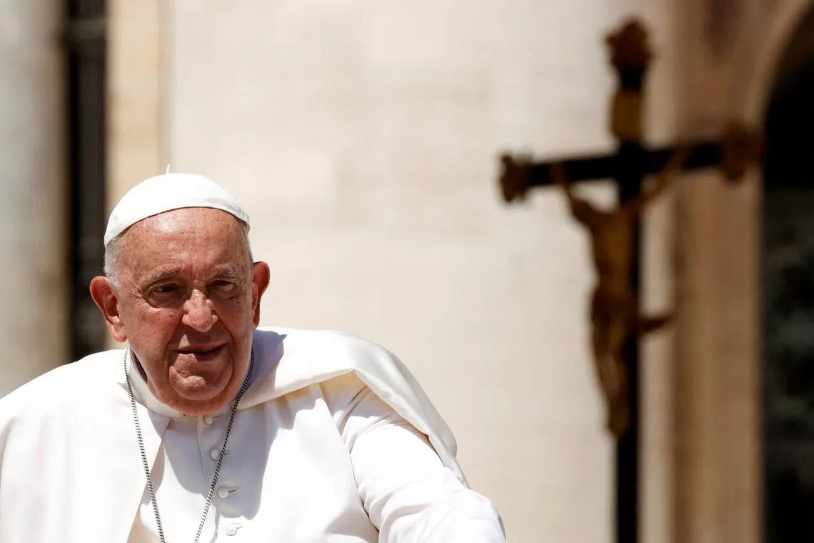 FILE PHOTO: Pope Francis attends the weekly general audience at Saint Peter's Square at the Vatican, June 12, 2024. REUTERS/Ciro De Luca/File Photo