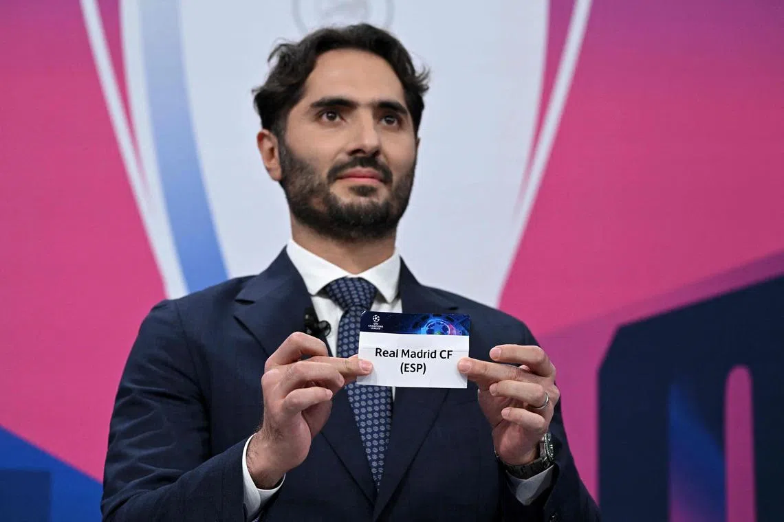 Uefa Champions League final ambassador and Turkish former footballer Hamit Altintop picking Real Madrid during the quarter-final draw.