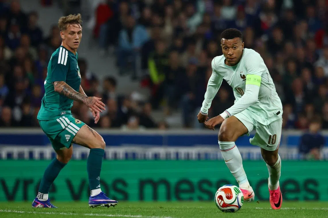 Olise stakes World Cup claim with hat-trick in France win | The Straits  Times