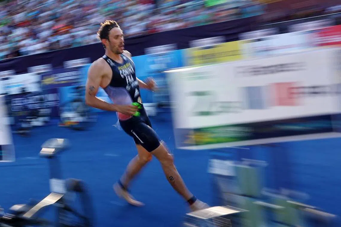 FILE PHOTO: 2022 European Championships - Triathlon - Olympiapark Triathlon Course, Munich, Germany - August 14, 2022 France's Dorian Coninx in action during the Triathlon Elite Mixed Relay REUTERS/Kai Pfaffenbach/File Photo