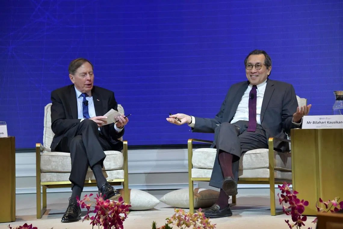 Retired US Army General David Petraeus speaking with Middle East Institute (MEI) Chairman Bilahari Kausikan at MEI's S R Nathan Distinguished Lecture on Dec 13 at Orchard Hotel.