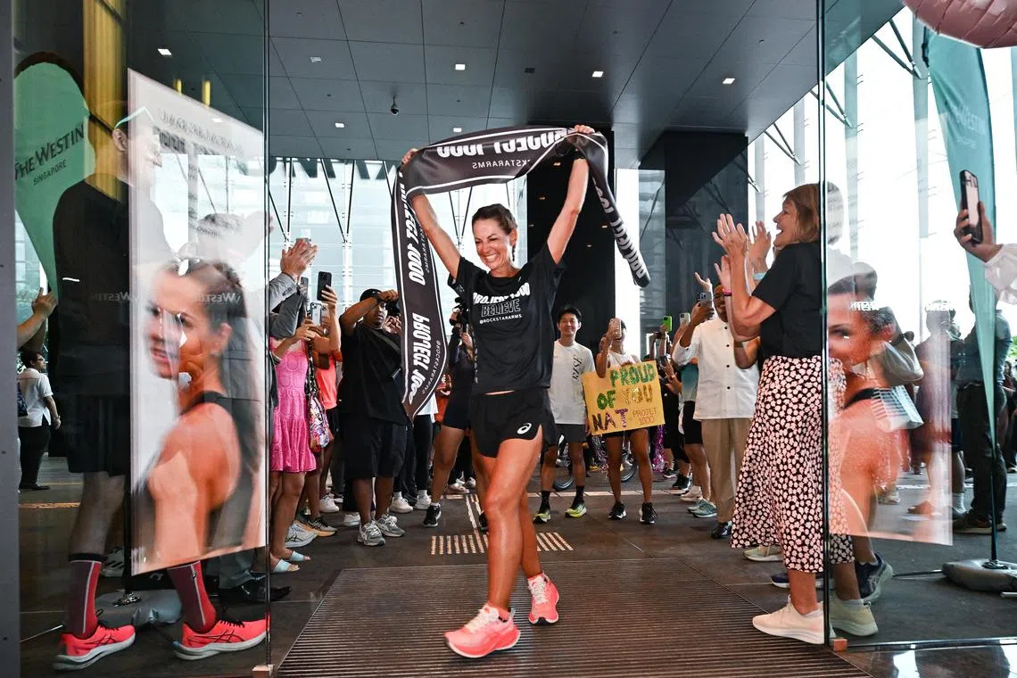 Natalie Dau crossing the finish line at The Westin Singapore on June 5, 2024.