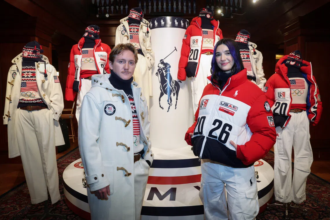 Team USA Paralympic snowboard athlete Brenna Huckaby and Team USA Olympic snowboard athlete Red Gerard pose in the Ralph Lauren designed official Team USA's Opening and Closing Ceremony uniform for the Milano-Cortina 2026 Winter Olympic Games, at an event unveiling the collection, in New York City, U.S., December 3, 2025. REUTERS/Mike Segar
