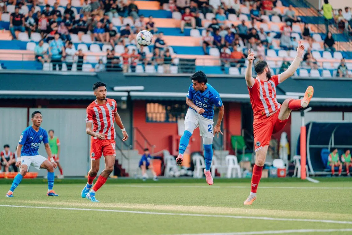 Lion City Sailors' Adam Swandi heading in their second goal against Tanjong Pagar United in their Singapore Premier League match at the Jurong East Stadium on Sept 14.
