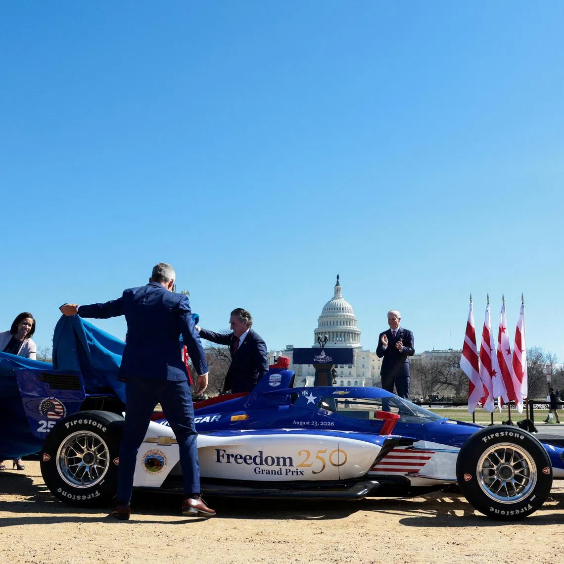 U.S. Secretary of Transportation Sean Duffy, Interior Secretary Doug Burgum, District of Columbia Mayor Muriel Bowser and IndyCar Series officials unveil the Freedom 250 Grand Prix race course outside the U.S. Capitol in Washington, D.C., U.S., March 9, 2026. REUTERS/Evelyn Hockstein