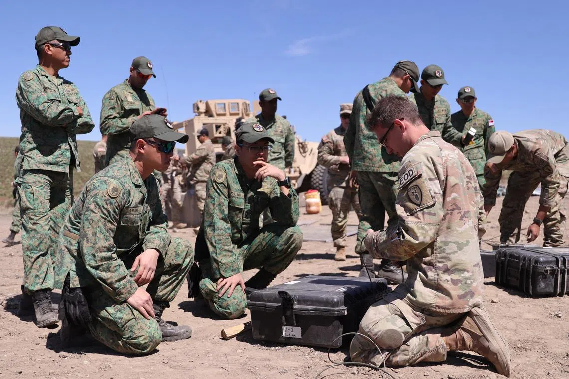 Personnel from 53rd Ordnance Company and the 36th Battalion, Singapore Combat Engineers preparing for a live firing exercise.