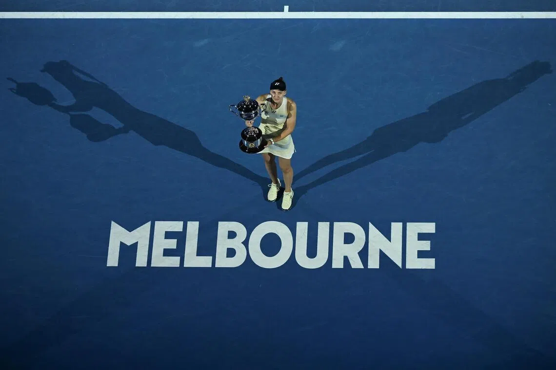 Elena Rybakina of Kazakhstan poses  with the Daphne Akhurst Memorial Cup after winning the Australian Open women's singles title. 