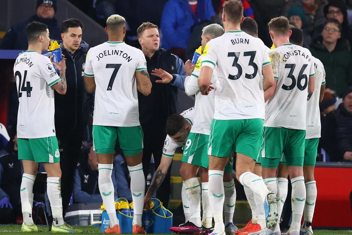 Newcastle United manager Eddie Howe gives instructions to his players during a break in play.