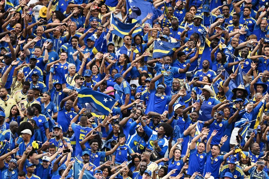 Soccer Football - FIFA World Cup 2026 - Group E - Germany v Curacao - Houston Stadium, Houston, Texas, U.S. - June 14, 2026 Curacao fans celebrate their first goal, scored by Livano Comenencia REUTERS/Annegret Hilse
