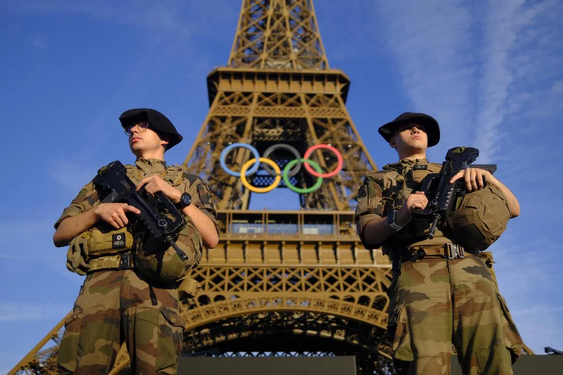 French soldiers are posted around the Eiffel Tower ahead of the Paris Olympics, which is set to start on July 22, 2024.