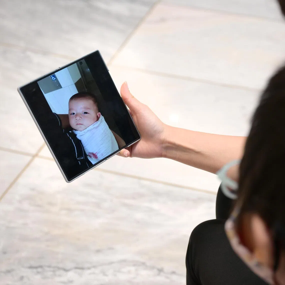 An 11 year-old Singaporean, known here as Adrian, is the first paediatric patient with GNAO1, a rare genetic neurological disorder, in Singapore and  Asia to undergo Deep Brain Stimulation surgery for this condition. Adrian (with his back and his mother Felicia, 42, looking at a baby photo of Adrian.