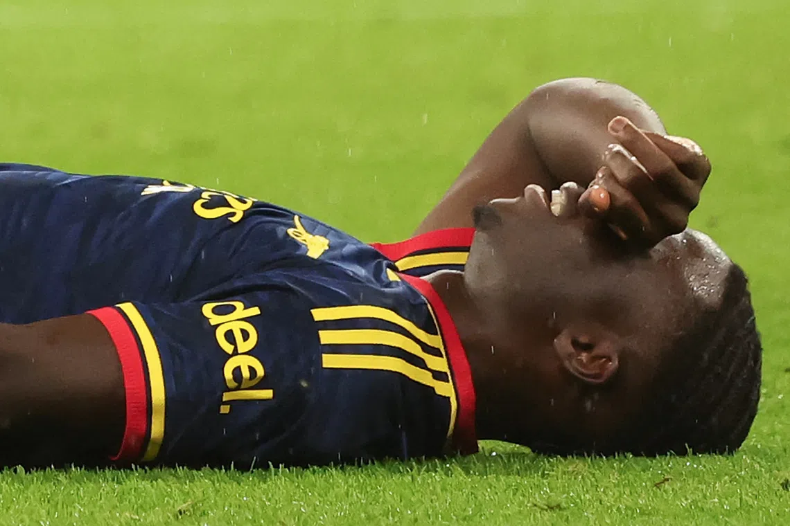 Arsenal’s Bukayo Saka went off early after falling to the turf grabbing his thigh.