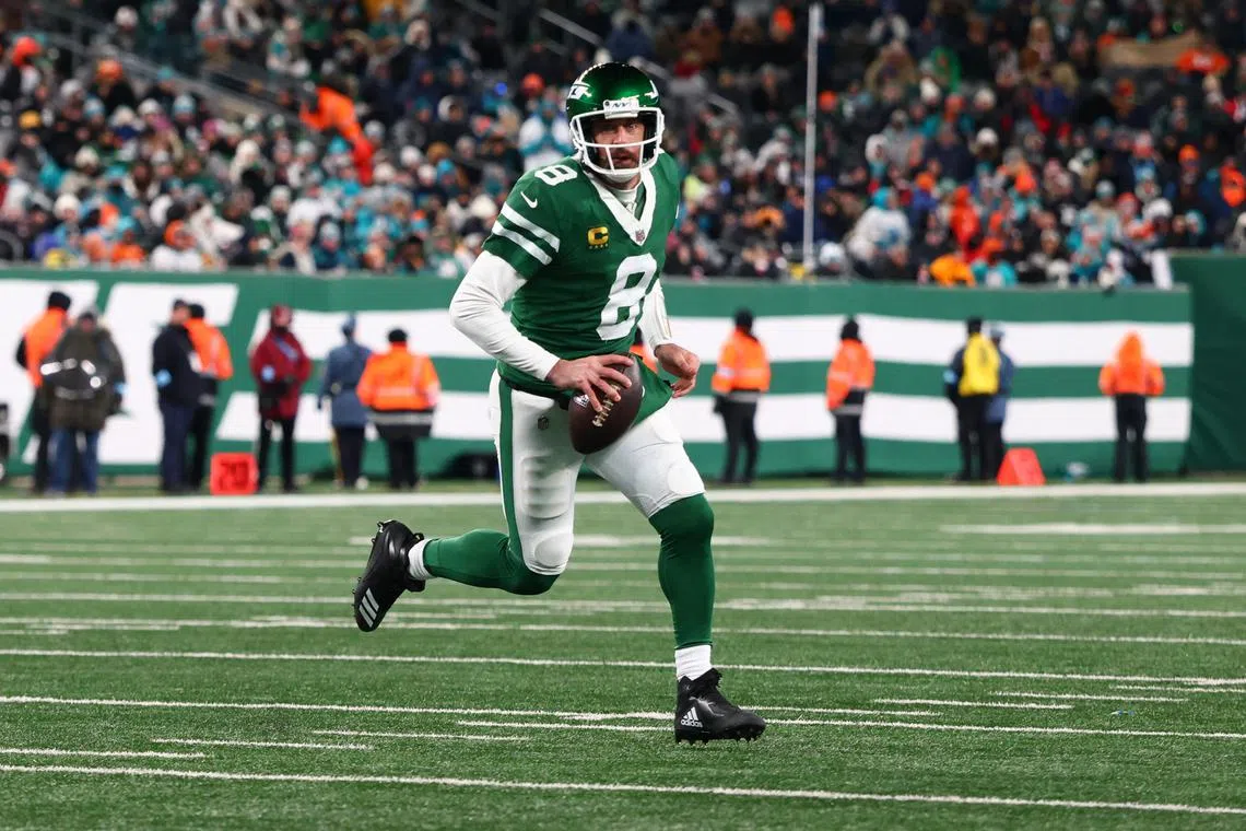 FILE PHOTO: Jan 5, 2025; East Rutherford, New Jersey, USA; Aaron Rodgers (8) runs with the ball during the third quarter of their game against the Miami Dolphins at MetLife Stadium. Mandatory Credit: Ed Mulholland-Imagn Images