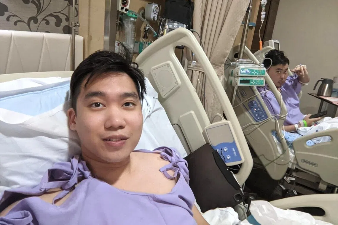 Mr Tew (left) recovering at Mount Elizabeth Hospital together with Mr Pang, post-surgery. 