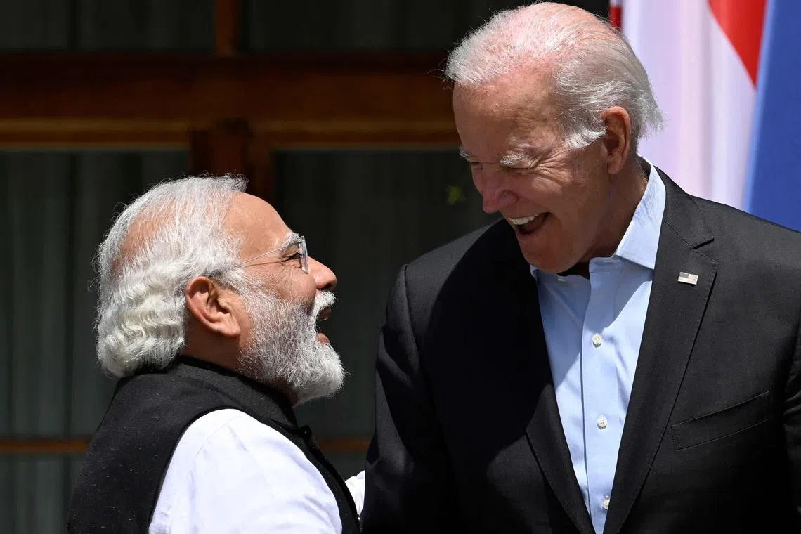 (FILES) In this June 27, 2022, file photo, US President Joe Biden (R) greets India's Prime Minister Narendra Modi as they arrive to attend the outreach program on at Elmau Castle, southern Germany, during the Group of Seven Summit. Biden will host Modi for a state visit on June 22, 2023, that will affirm the two countries' "deep and close partnership," the White House announced May 10, 2023. (Photo by Tobias SCHWARZ / AFP)