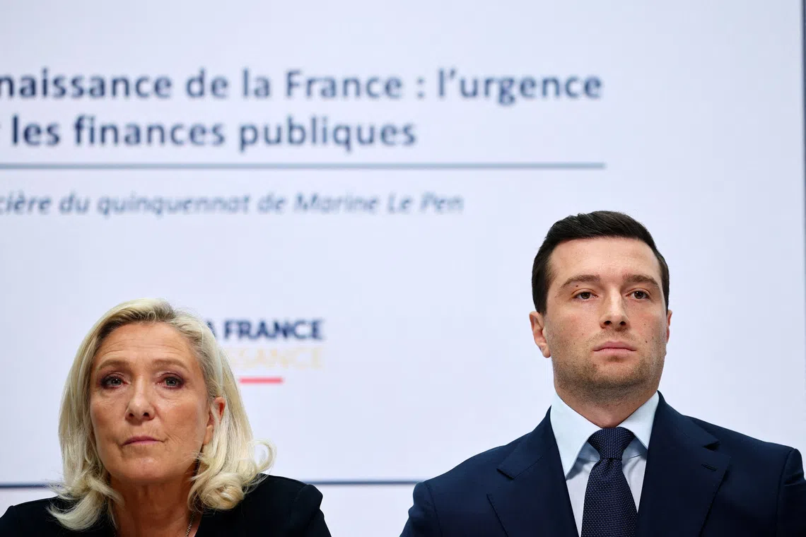 French far-right leader Marine Le Pen, member of parliament for the French far-right Rassemblement National (National Rally - RN) party and candidate for the 2027 French presidential election, and Jordan Bardella, president of the French far-right Rassemblement National party, attend a press conference to present the party's alternative budget for 2027 and its fiscal strategy, in Paris, France, October 6, 2026. REUTERS/Sarah Meyssonnier