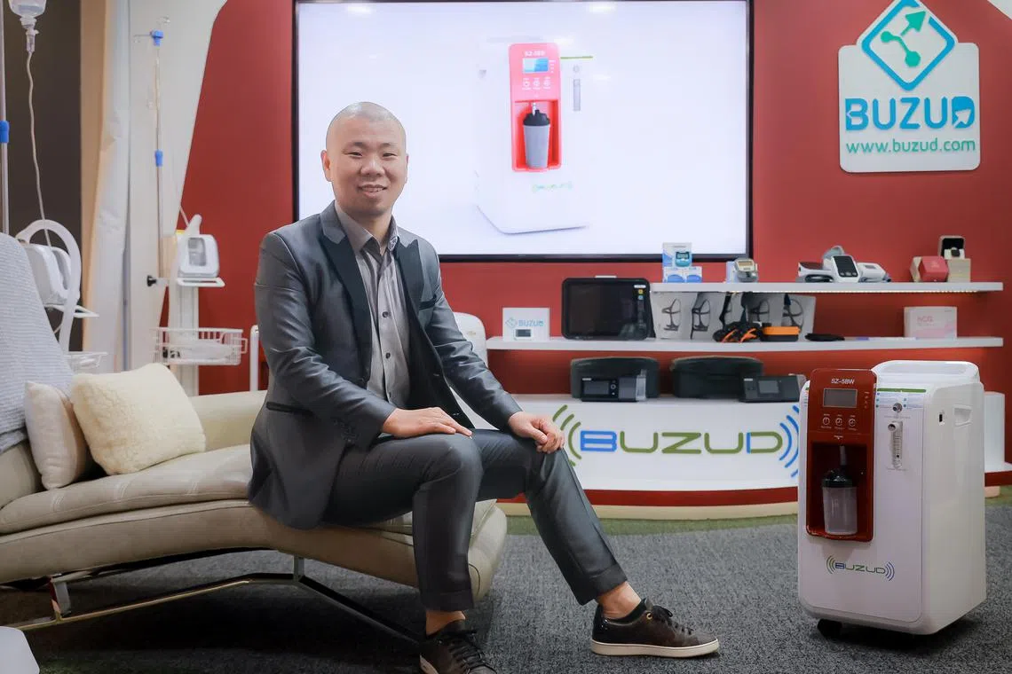 Buzud Singapore chief executive Frankie Fan at his shop in Raffles Hospital, 9 Dec 2022. The company specialises in preventative healthcare with their pro-level home medical devices.