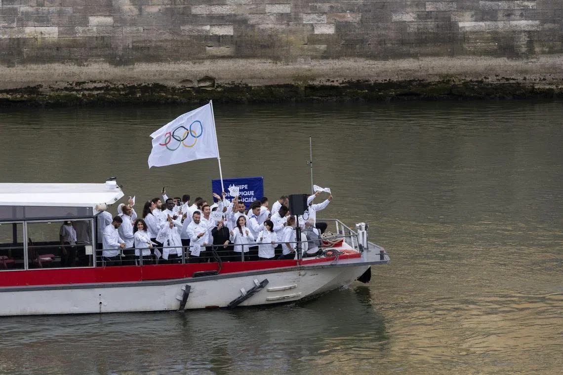 The Refugee Olympic Team on a boat along the River Seine during the opening ceremony of the Paris 2024 Olympic Games on Friday. 