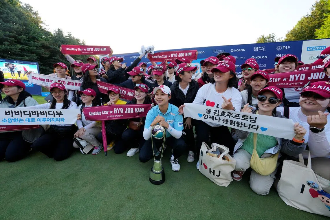 South Korean Kim Hyo-joo with supporters from her fan club Shooting Star after her win at the Aramco Team Series Korea.