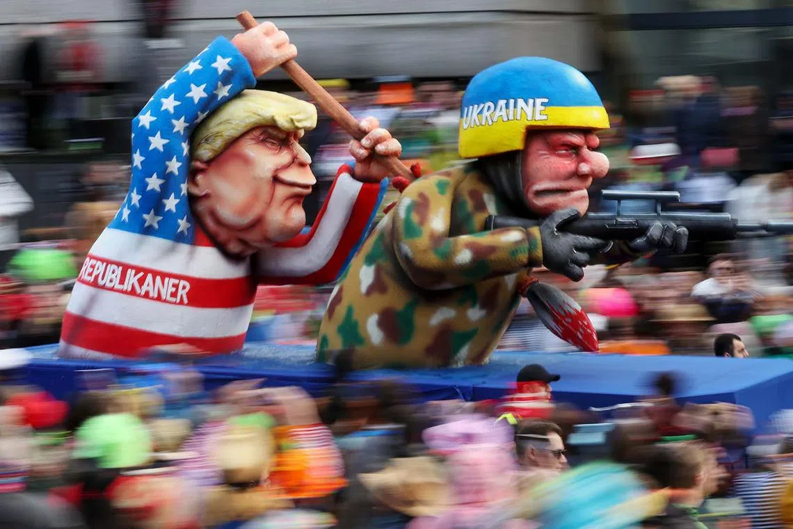 A carnival float depicting US presidential candidate Donald J. Trump and a Ukrainian soldier parades during the annual Rose Monday (Rosenmontag) parade in Duesseldorf, Germany, Feb 12, 2024. 