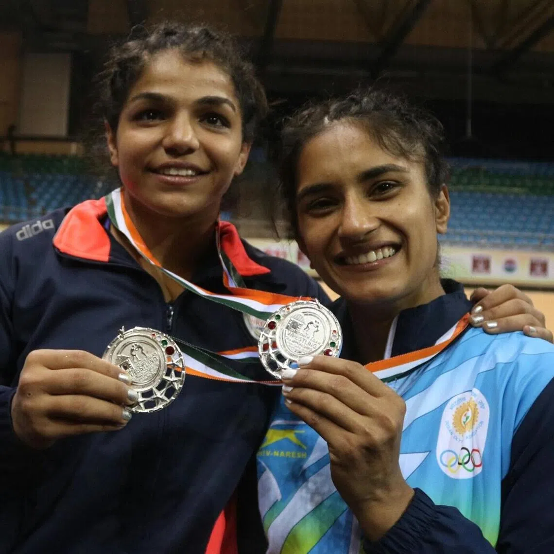 Indian wrestlers Sakshi Malik (left) and Vinesh Phogat were among the medal-winning athletes who accused ex-federation chief Brij Bhushan Sharan Singh of sexual harassment and stalking.
