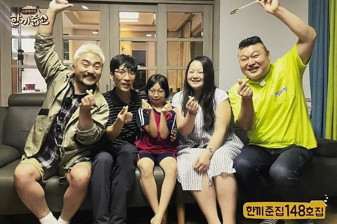 The Straits Times South Korea Correspondent Chang May Choon (second from right) seen here with her Korean husband and daughter, planked by TV host Kang Ho-dong (first from right) and actor Yoo Byung-jae. The family appeared in the 86th episode of the popular reality show Let's Eat Dinner Together, aired in June 2018.