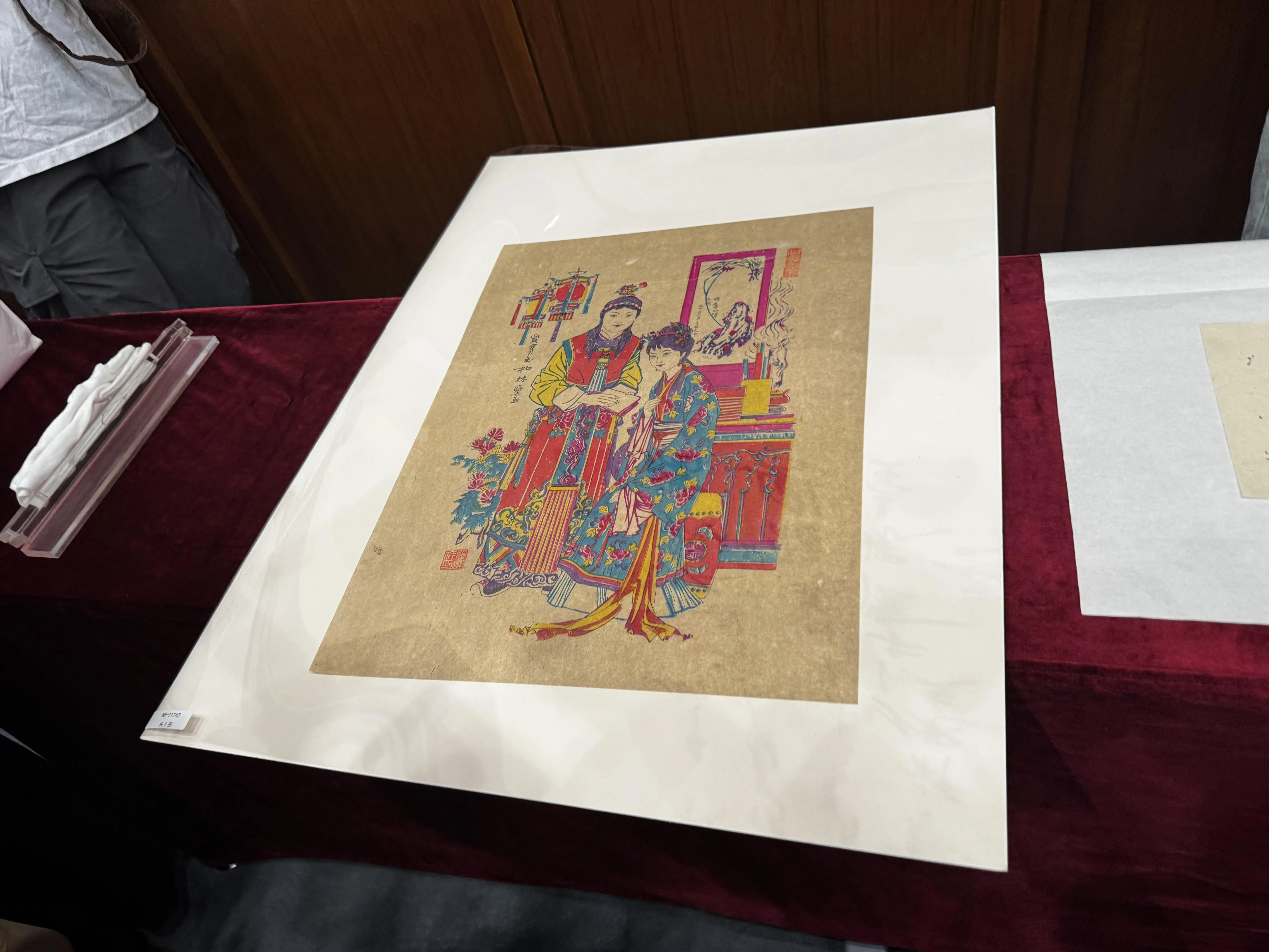 This Chinese New Year painting is believed to date from 1978.  The figures are Dream of the Red Chamber’s Jia Baoyu and Lin Daiyu, who seem to be reading poetry.